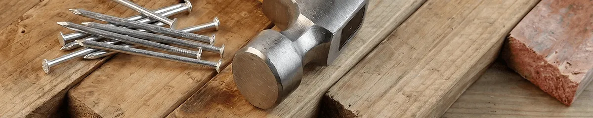 Hammer and nails on hardwood flooring boards in Dayton, OH