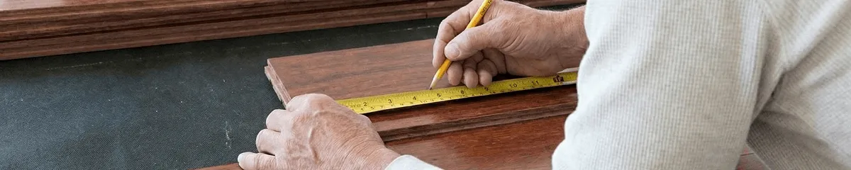 A professional installing wood flooring in Dayton, OH